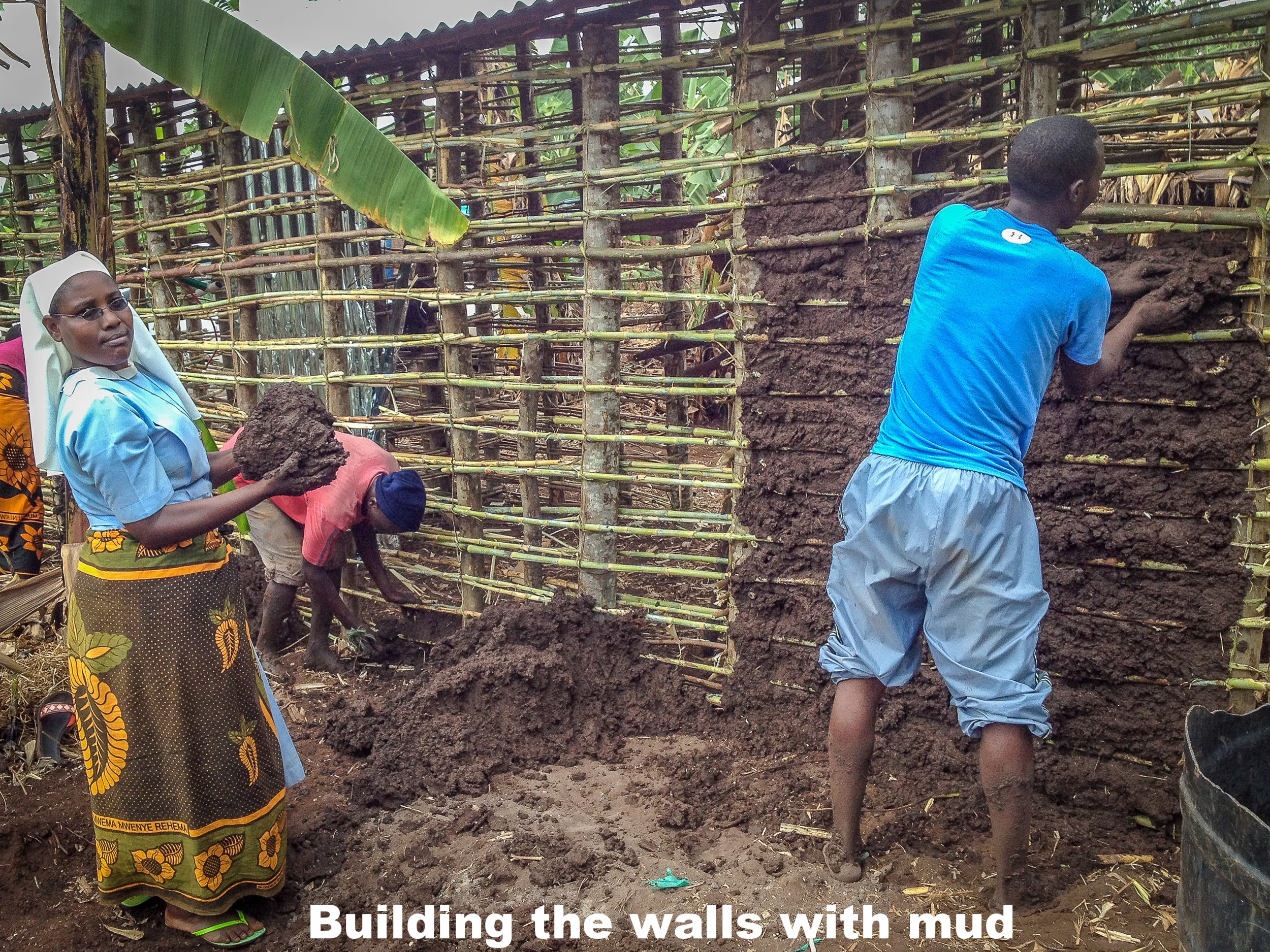 3. Building the walls with moist mud.jpg