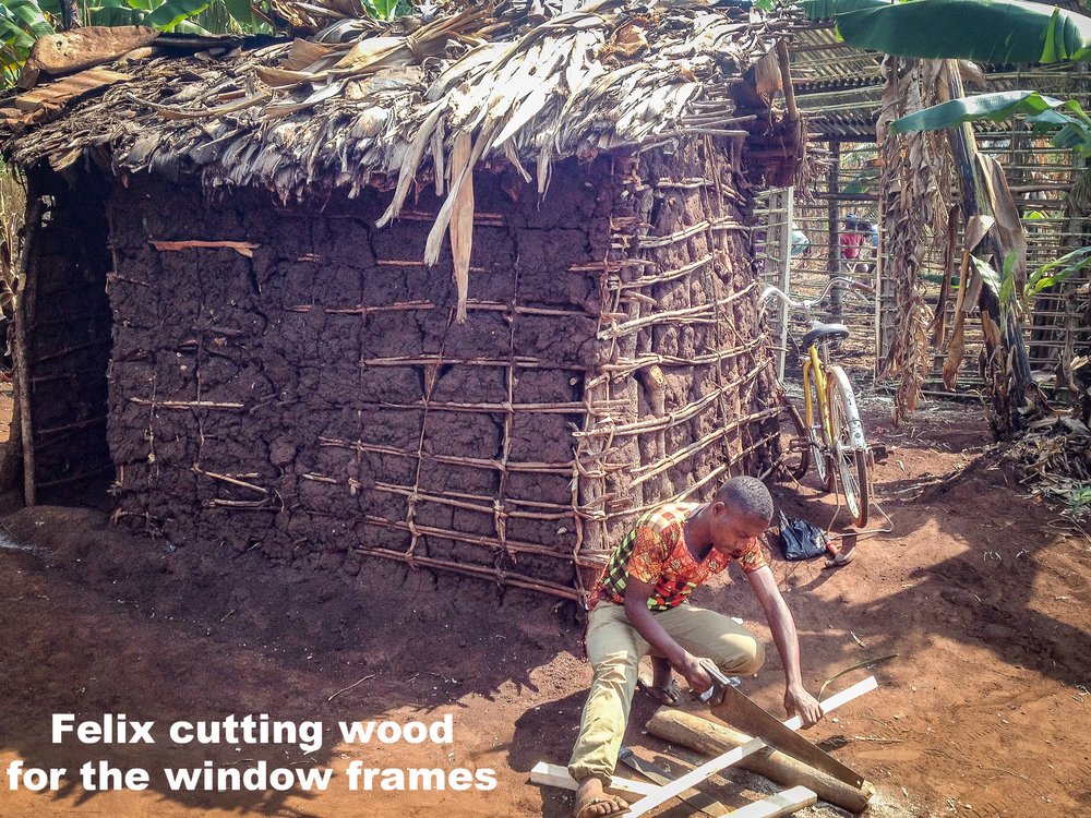 4. Our youth Felix cutting timber for window frames.jpg