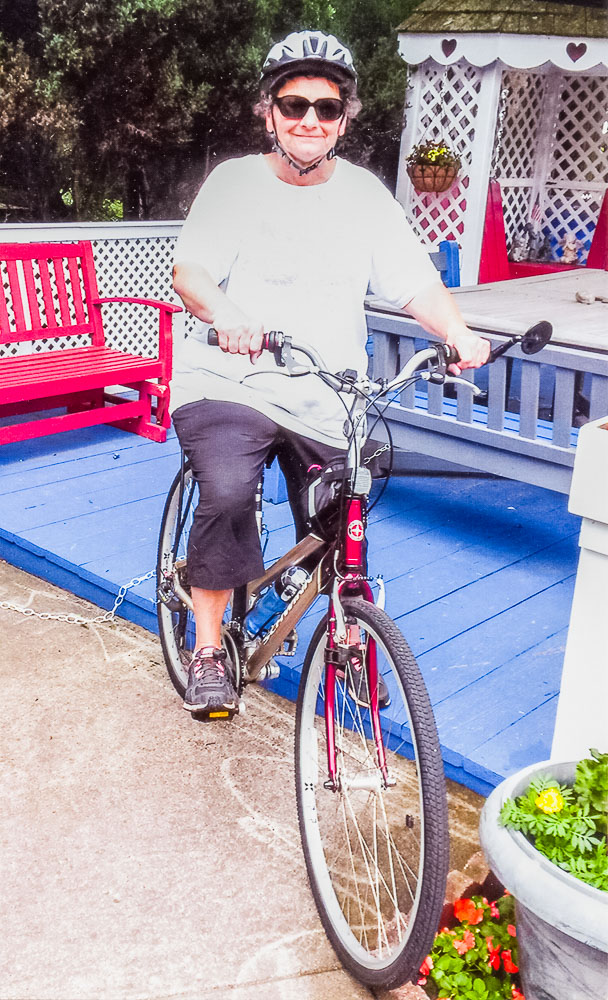 Gloria Saltzman with her bicycle ready for another ride.