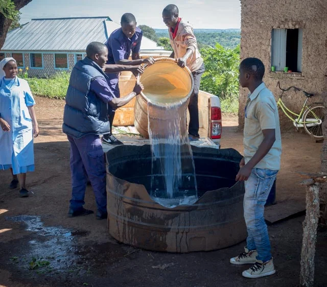 Currently water is fetched from a distant site and stored in a basin.