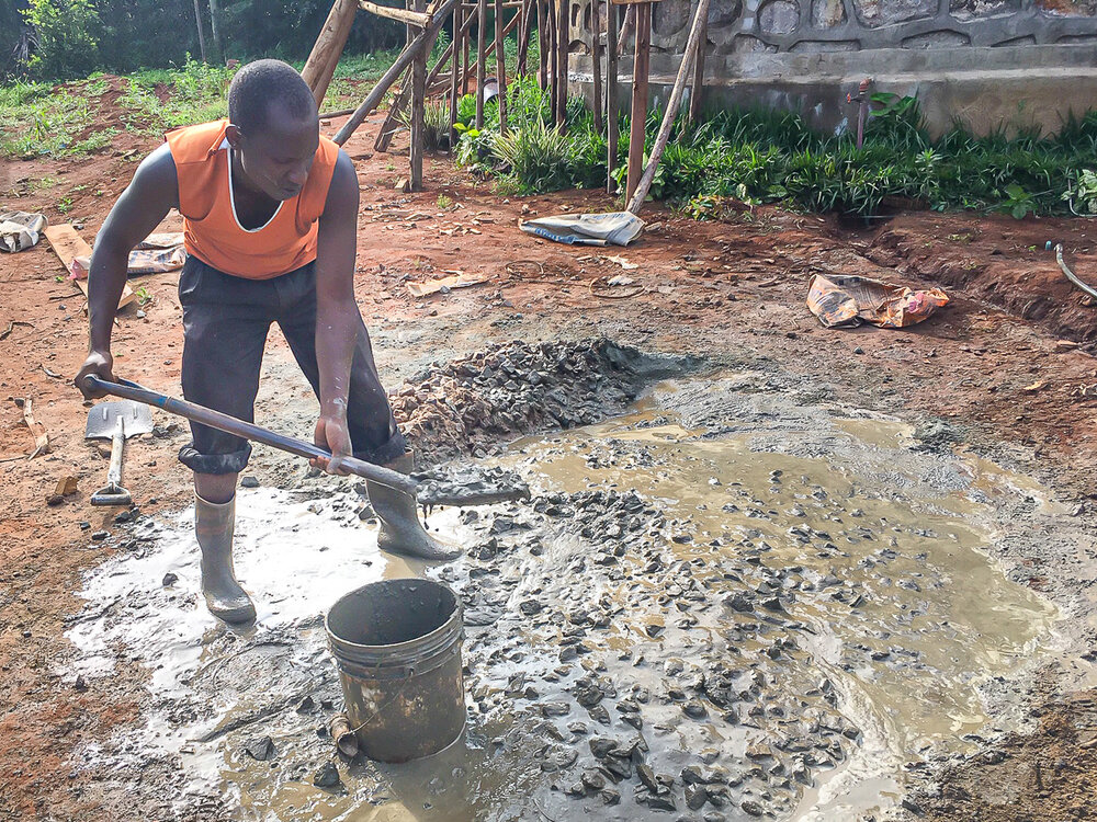 Working the concrete  - The Village Angels of Tanzania.jpg