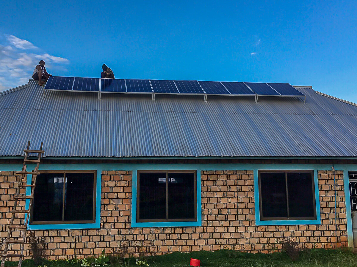 Solar panels being installed over the roof - The Village Angels of Tanzania.jpg