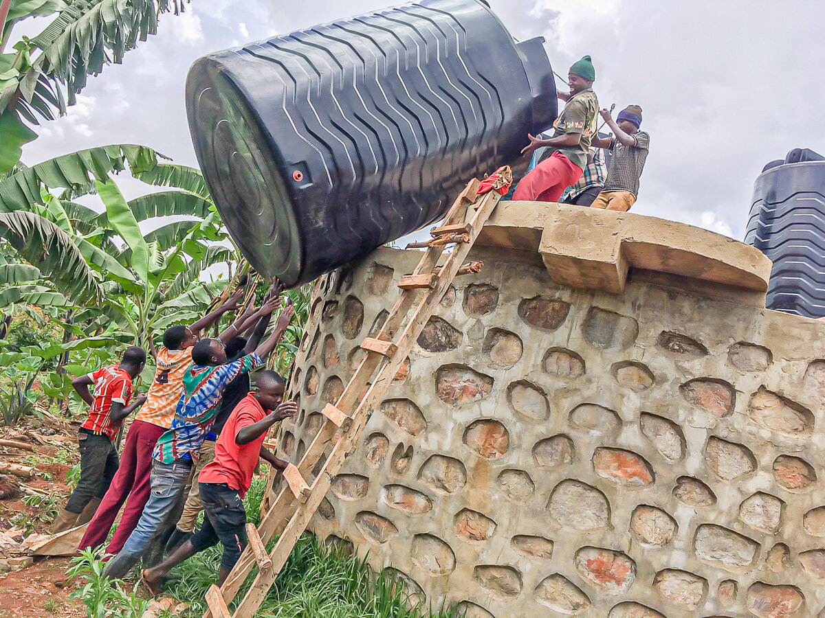 Hauling the tanks on top of the tower - The Village Angels of Tanzania.jpg