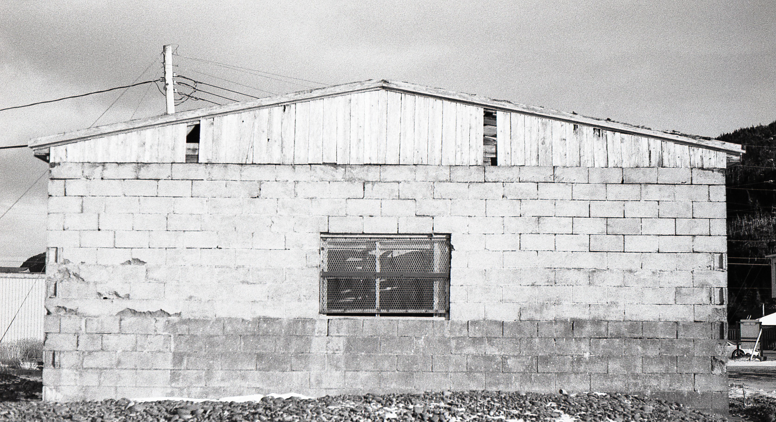 Victim of time and weather. Standing meters from the bay this storage building reflects its exposure to the relentless North Atlantic weather.