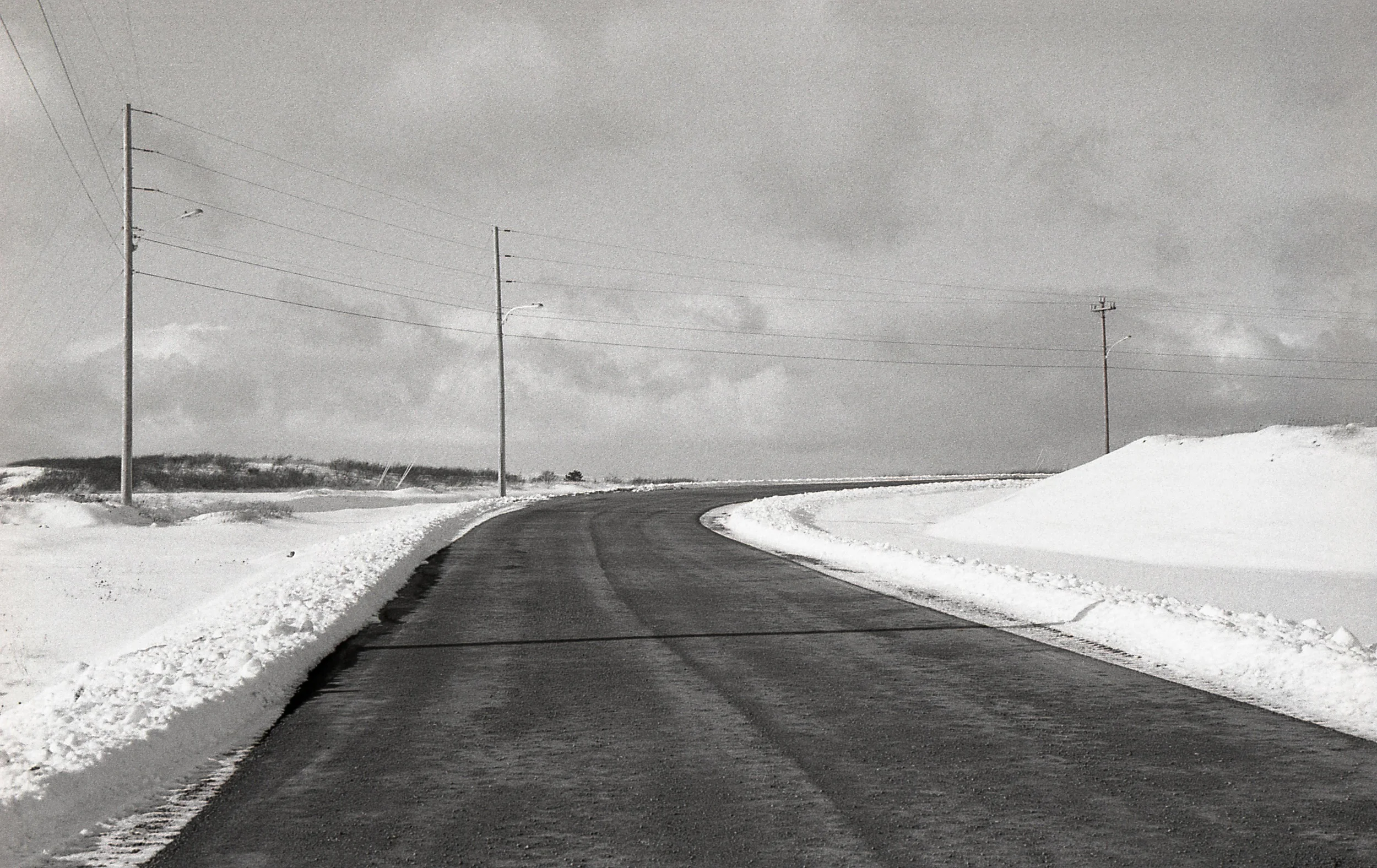 Road to nowhere. A new road built on the site of the former navel base. It leads to a construction site for an offshore oil project. Work on the project was mothballed when the price of crude collapsed. Its future remains uncertain.