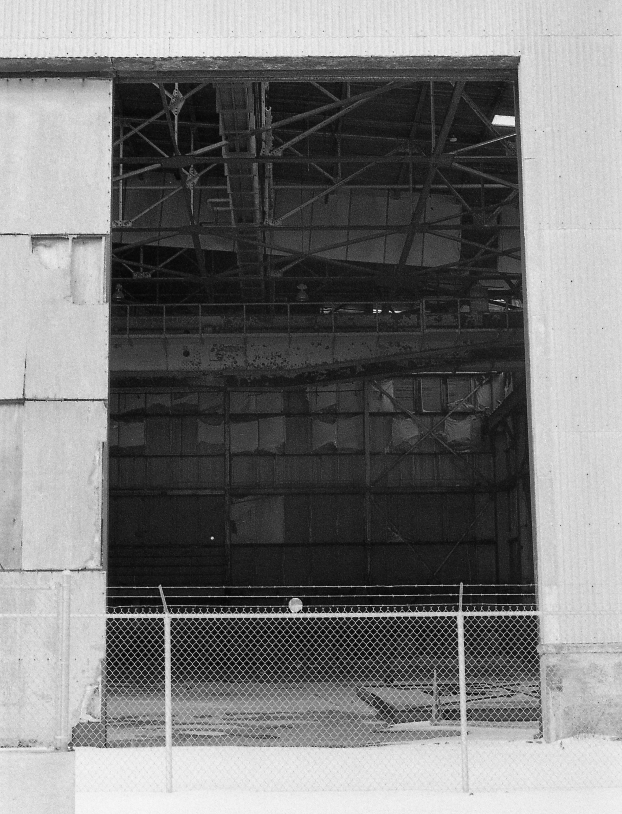 Disused aircraft hanger at the former United States Navy base at Argentia. This massive base constructed during World War II to protect the Atlantic convoys to Great Britain gradually transitioned from a full base with an air field and dockyards to a smaller facility tracking Soviet submarines in the North Atlantic. It closed in 1994.