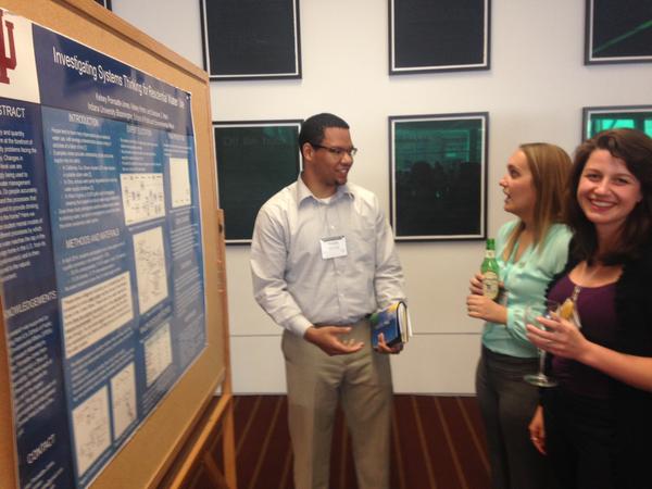 Kelsey Poinsatte-Jones and Kelsey Hinton presenting research at a conference