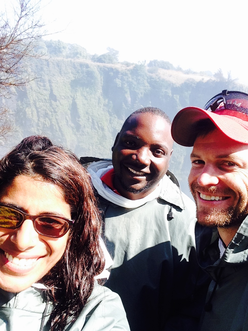 Shahzeen, Allan, and Drew - Happy and soaked at Victoria Falls, Zambia 2015