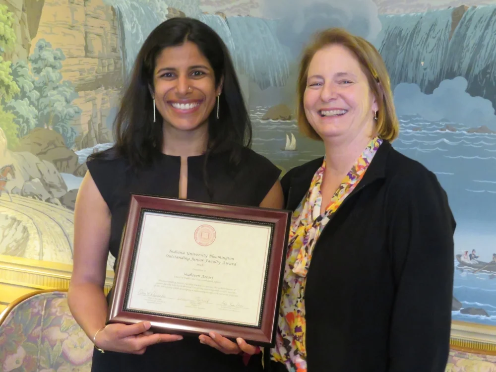 Shaz receives the award from Eliza Pavalko, IU's Vice Provost for Faculty and Academic Affairs