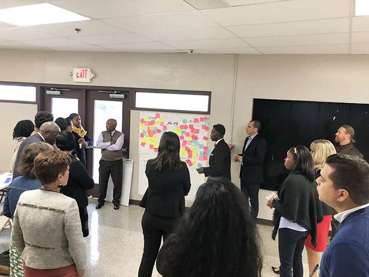 The Howard Connect Academy (HCA) design team members engage in discussion and brainstorming around design principles for the new school.