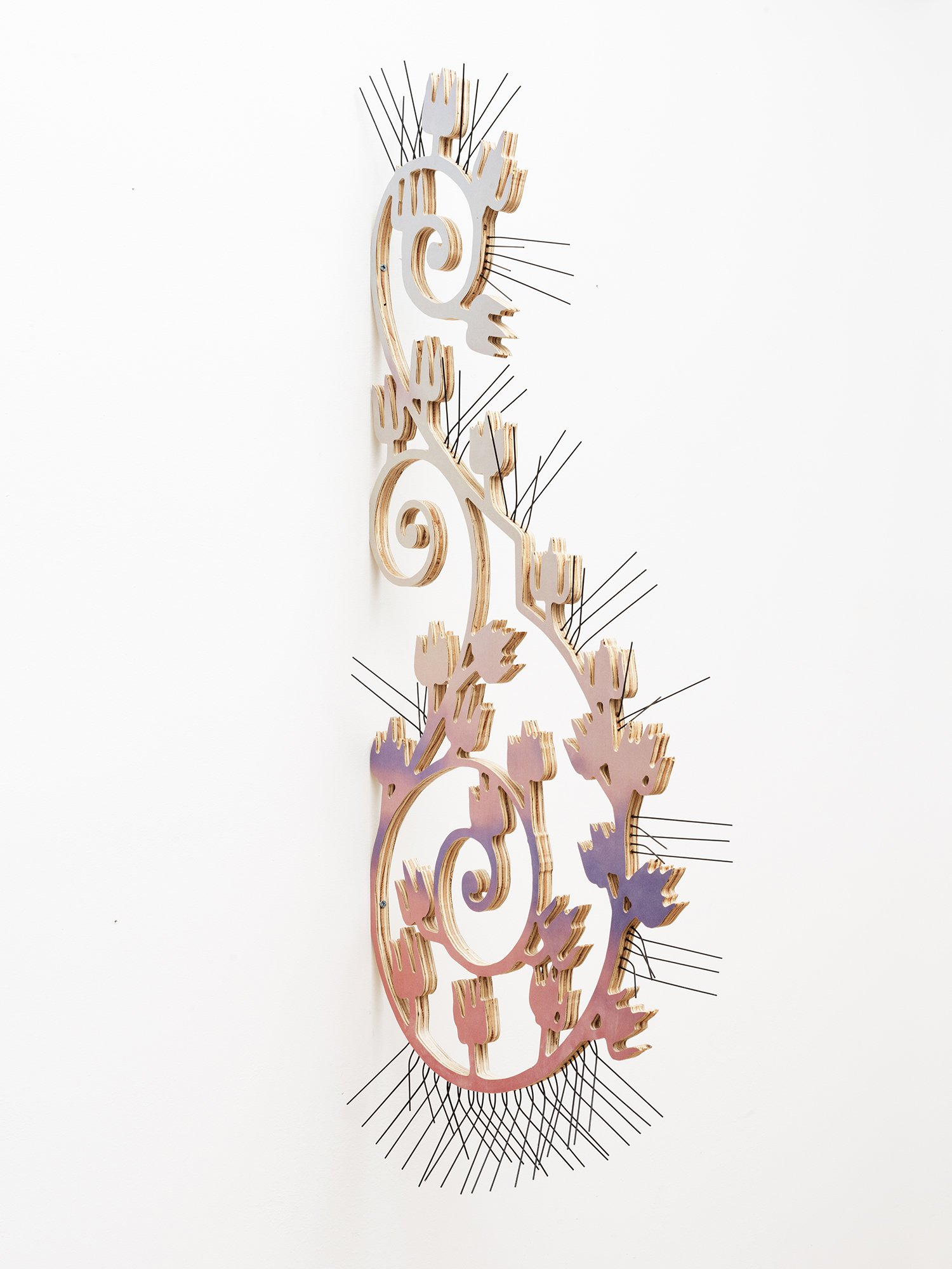  Forced Bloom, 2024 UV curable ink on plywood, vinyl, steel bird spikes 40 x 3 x 17 inches 