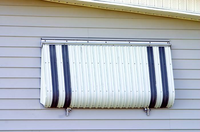 Shutters can protect your windows from heavy winds and flying debrisin storm. (Photo: iStock) 
