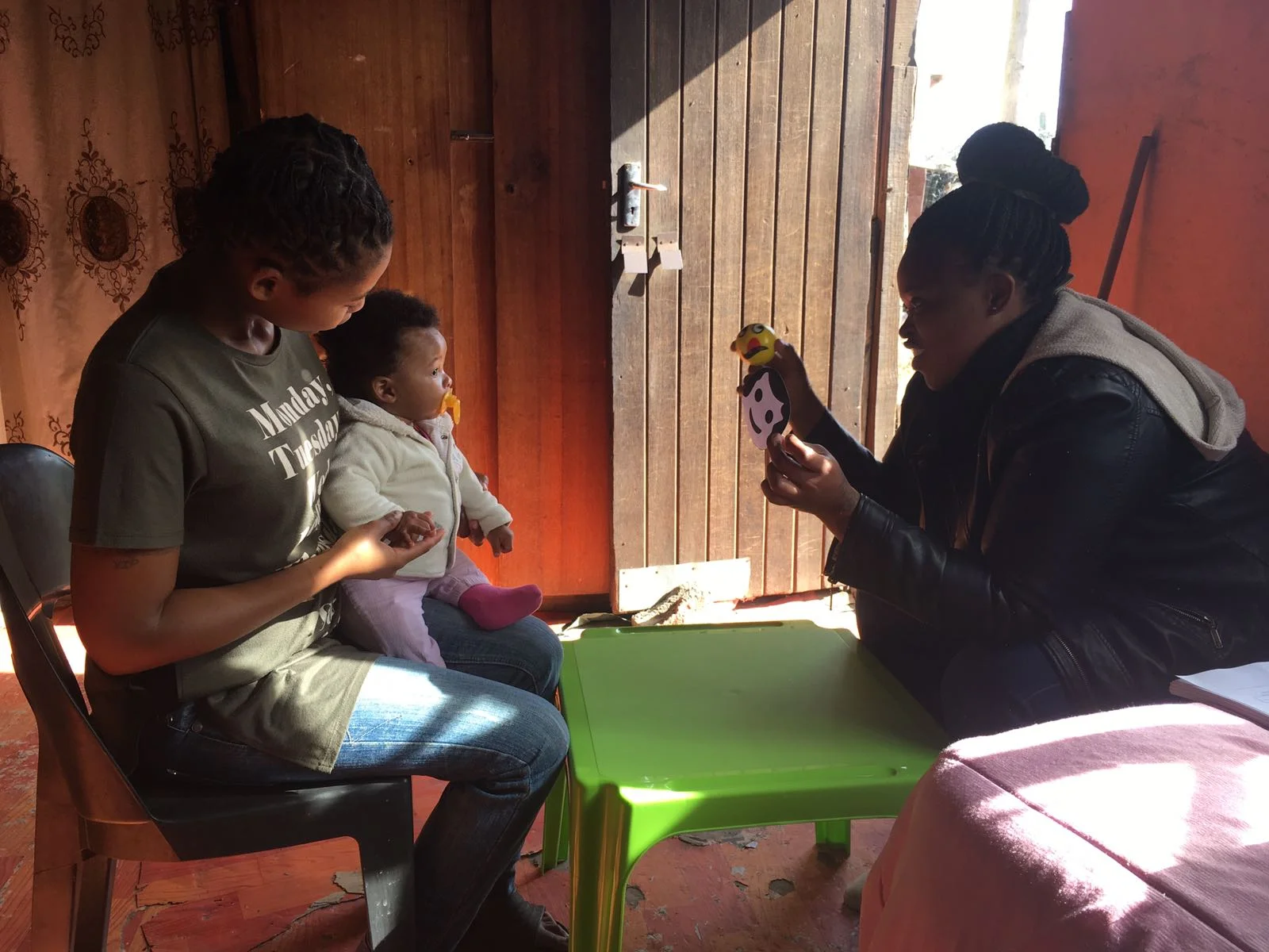 Research Assistant administering child cognitive development assessment.
