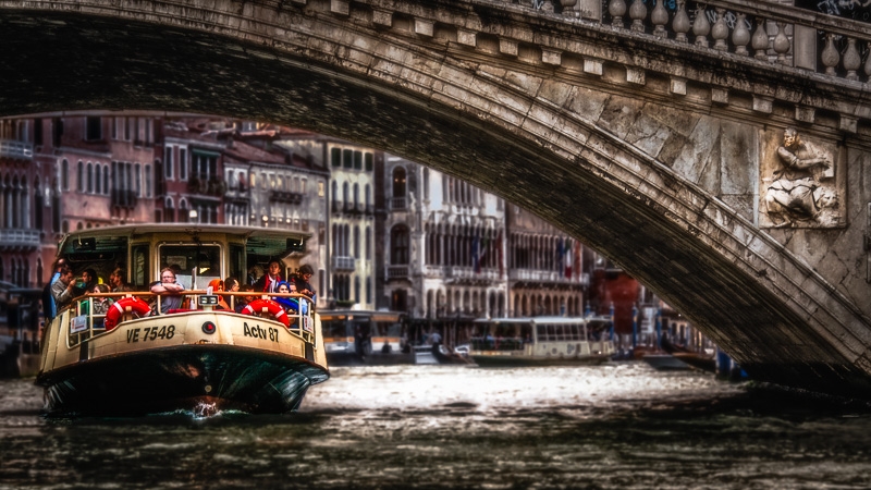 A Venetian Vaporetto or Water Bus as it Passes Under the Rialto Bridge