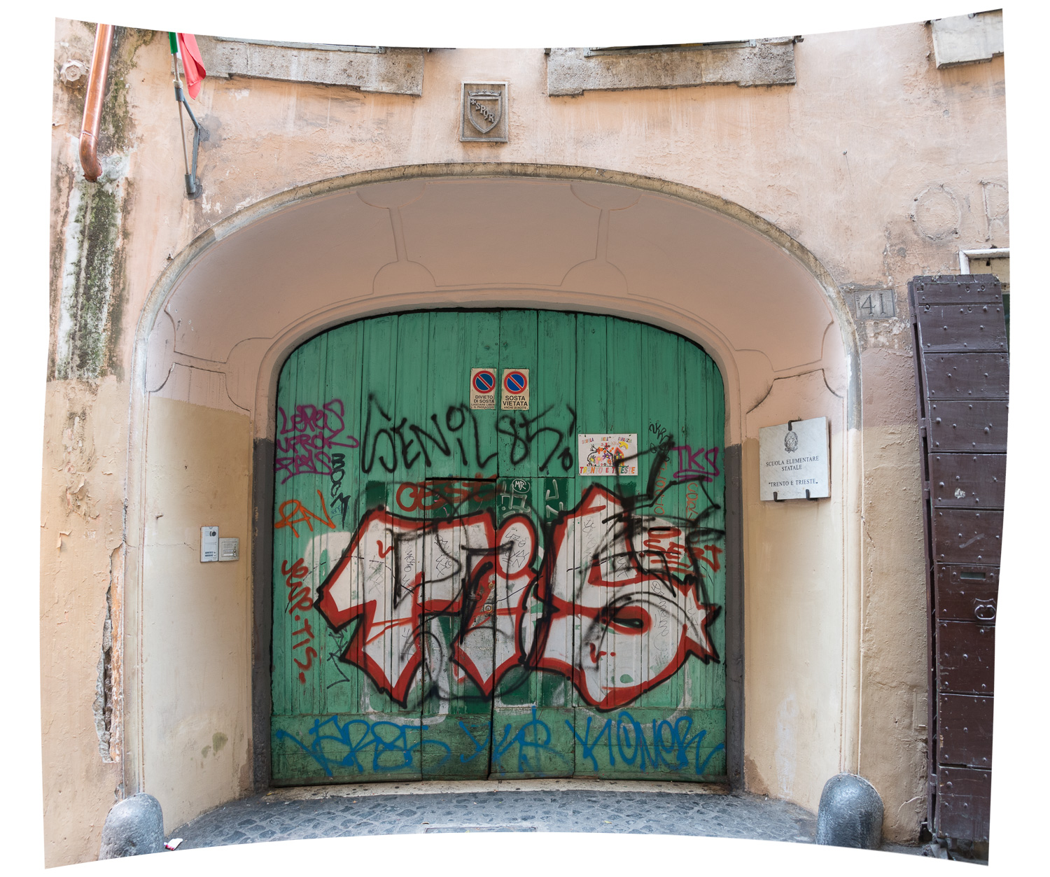 The original graffiti'd school entrance - two photos stitched together in Photoshop