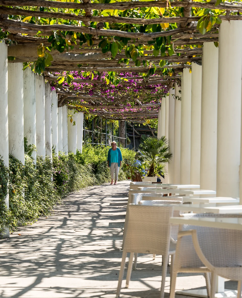 This loggia leads from the dining veranda to the pool