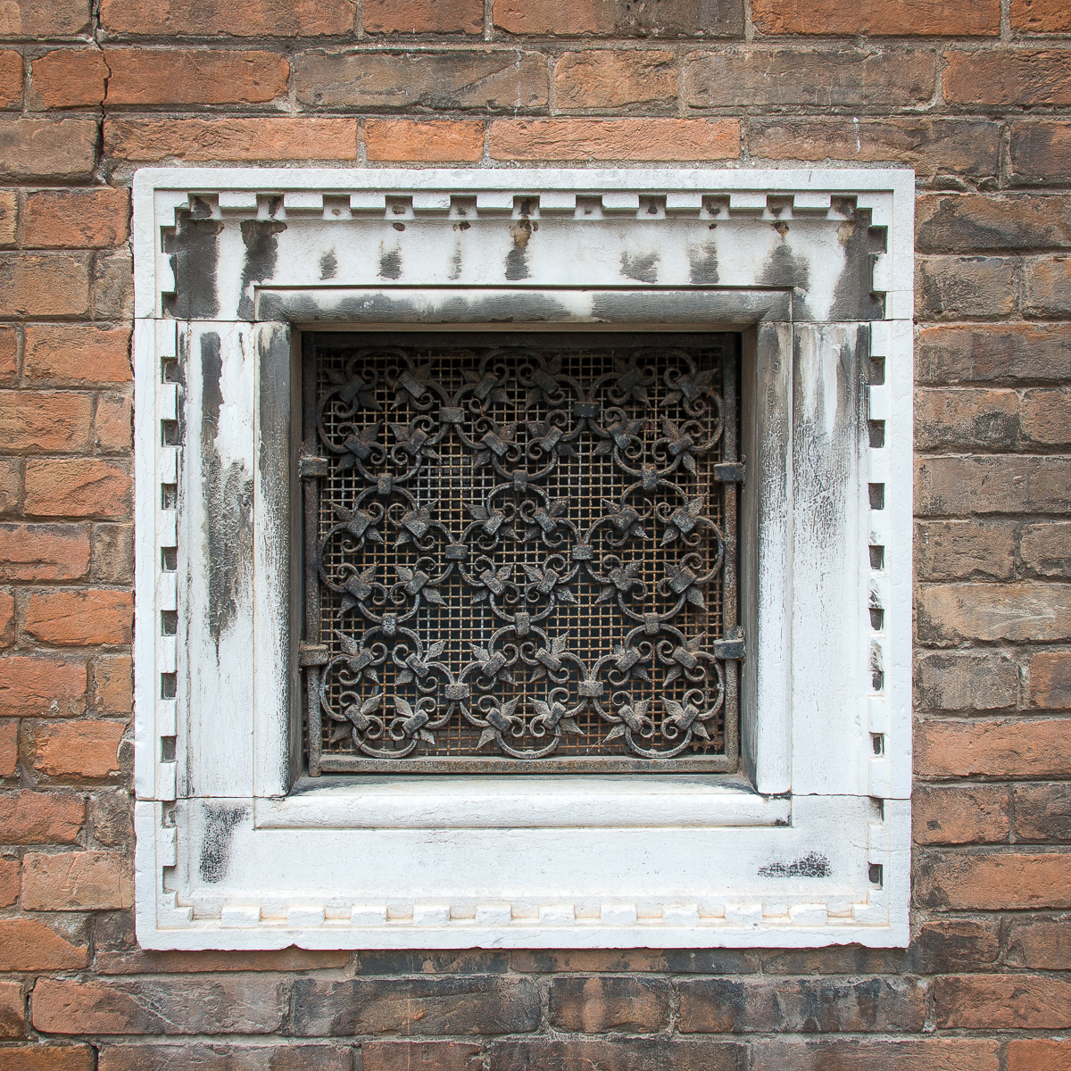 Ironwork framed with carved stone