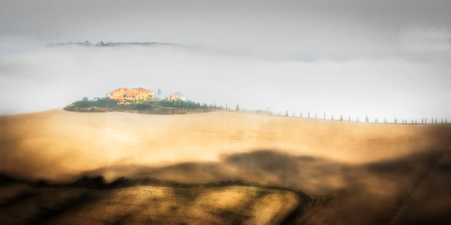Tuscan cypress line the drive to this charming farm compound
