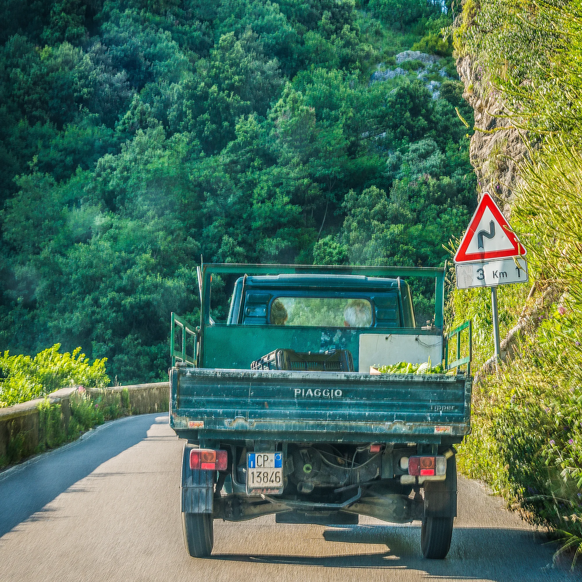 A pokey Piaggio on the serpentine road