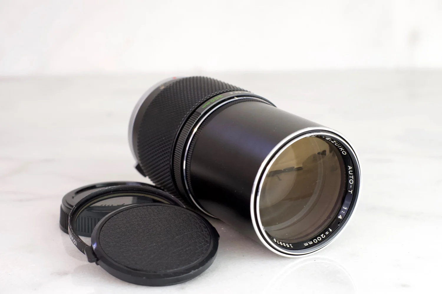 Olympus OM System E. Zuiko Auto T 200mm F/4 Portrait Prime Lens - With UV Filter, Front and Rear Lens Caps