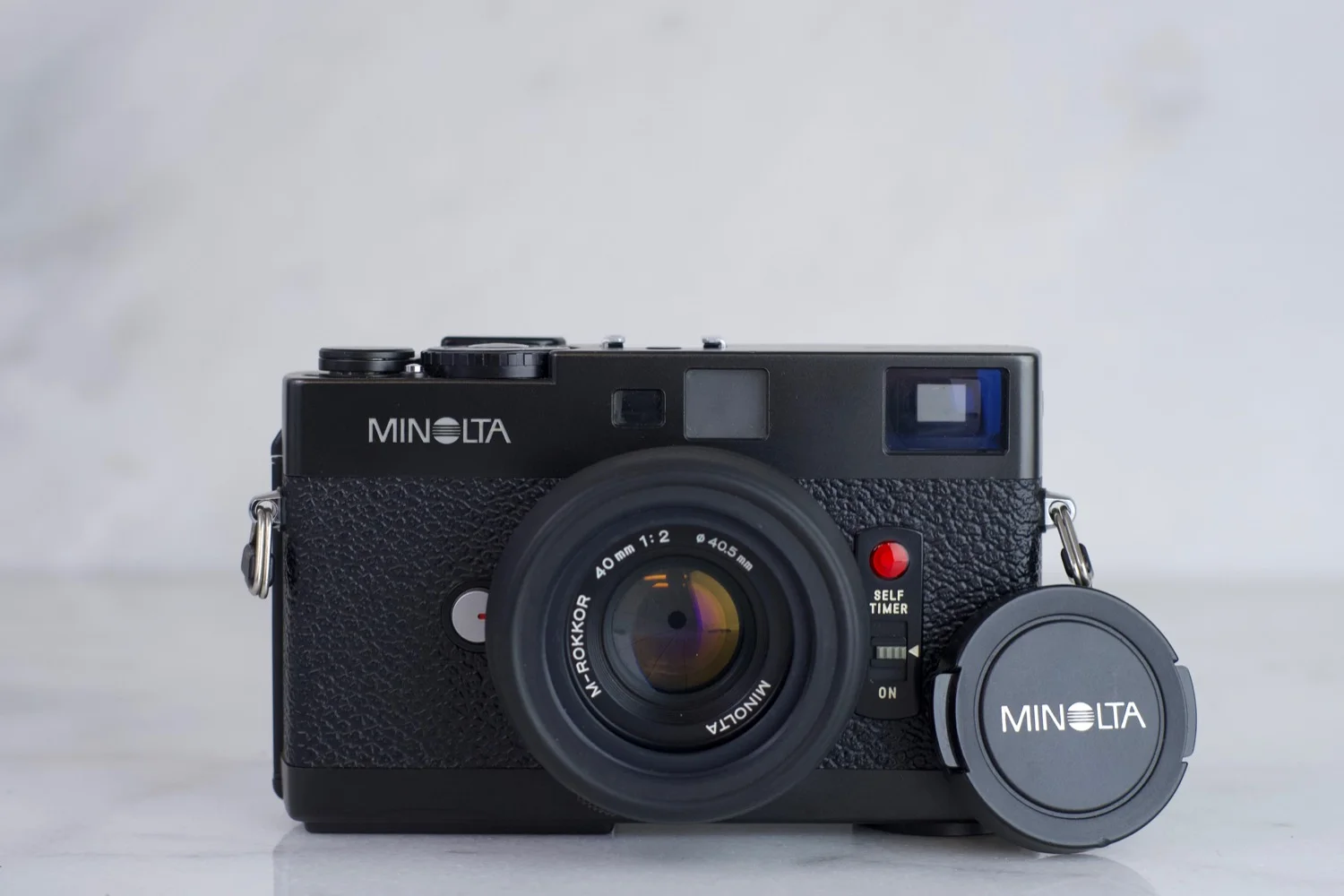 Minolta CLE with Minolta M-Rokkor 40mm F/2 Lens, Lens Cap, Lens Hood and Batteries - 35mm Film Rangefinder Camera