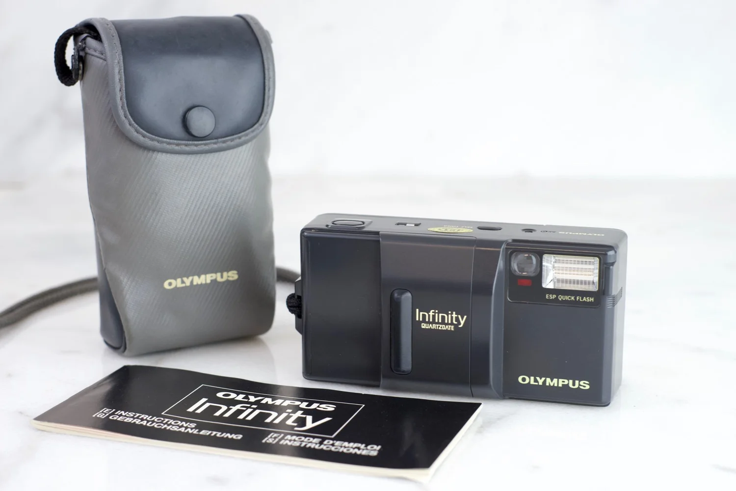 Olympus Infinity 35mm f/2.8 Zuiko Lens Point and Shoot 35mm Film Camera with Case and Manual