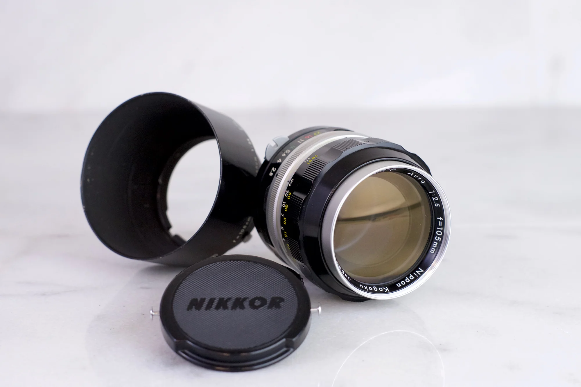 Nikon Nikkor P Auto 105mm F/2.5 Pre-AI with Rabbit Ears Fast Prime Portrait Lens with Nikon HS4 Lens Hood and Lens Caps