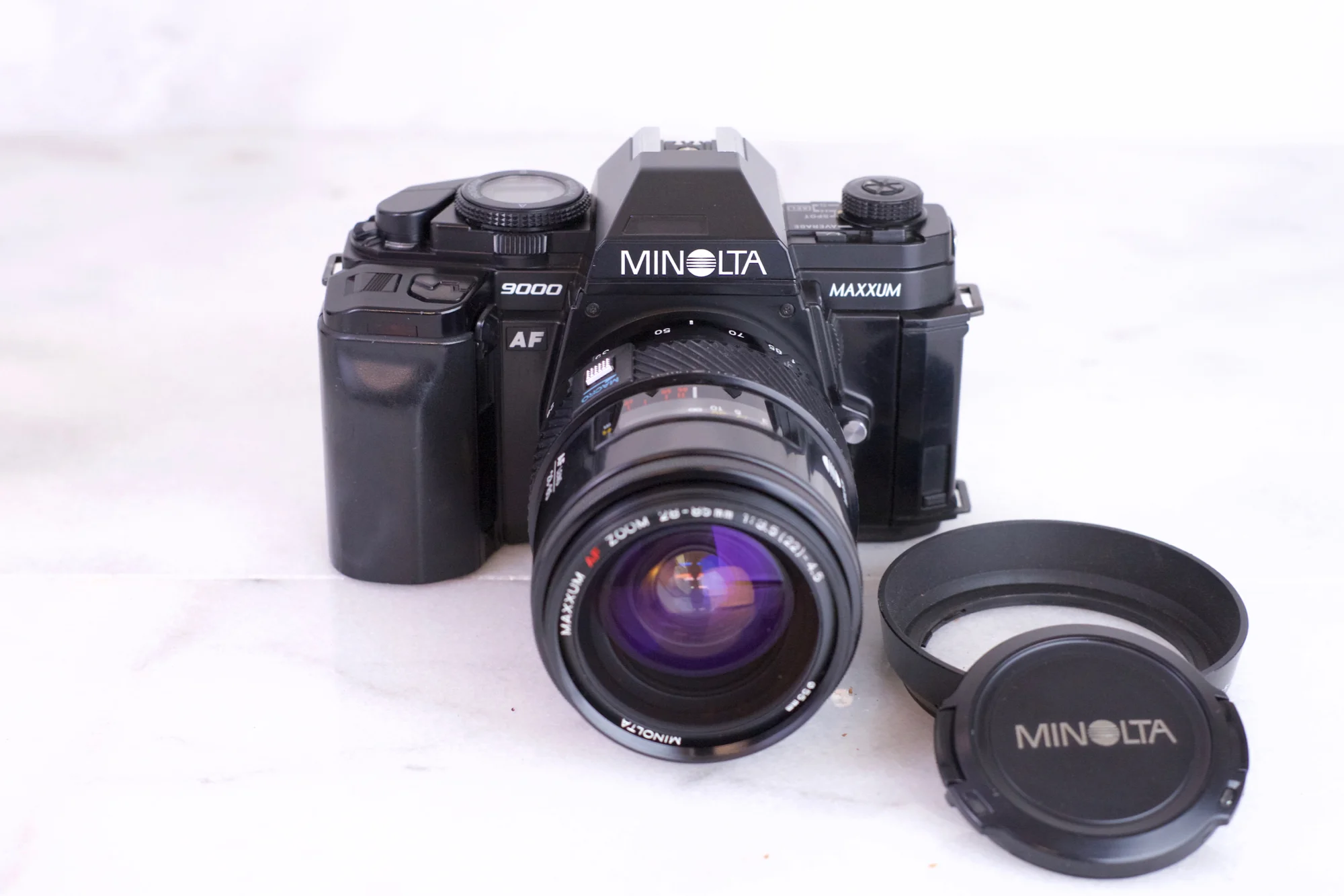 Minolta Maxxum 9000 35mm Film SLR Camera with Minolta Maxxum AF 28-85mm F/3.5-4.5 Zoom Lens, Cap and Lens Hood