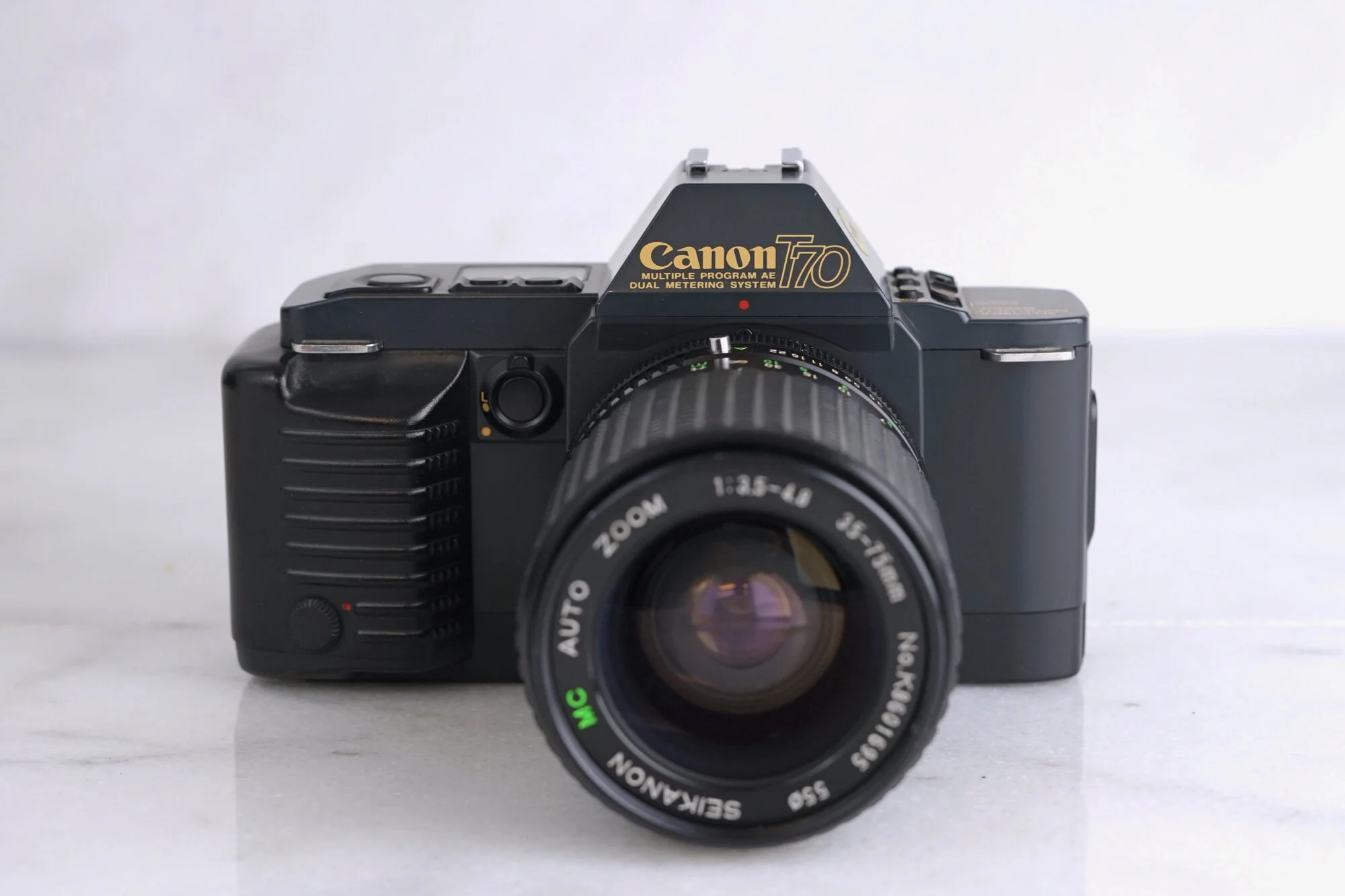 Canon T70 SLR 35mm Film Camera with Albinar ADG 28-80mm f/3.9-4.9 Macro Focusing Zoom Lens - Fully Functional