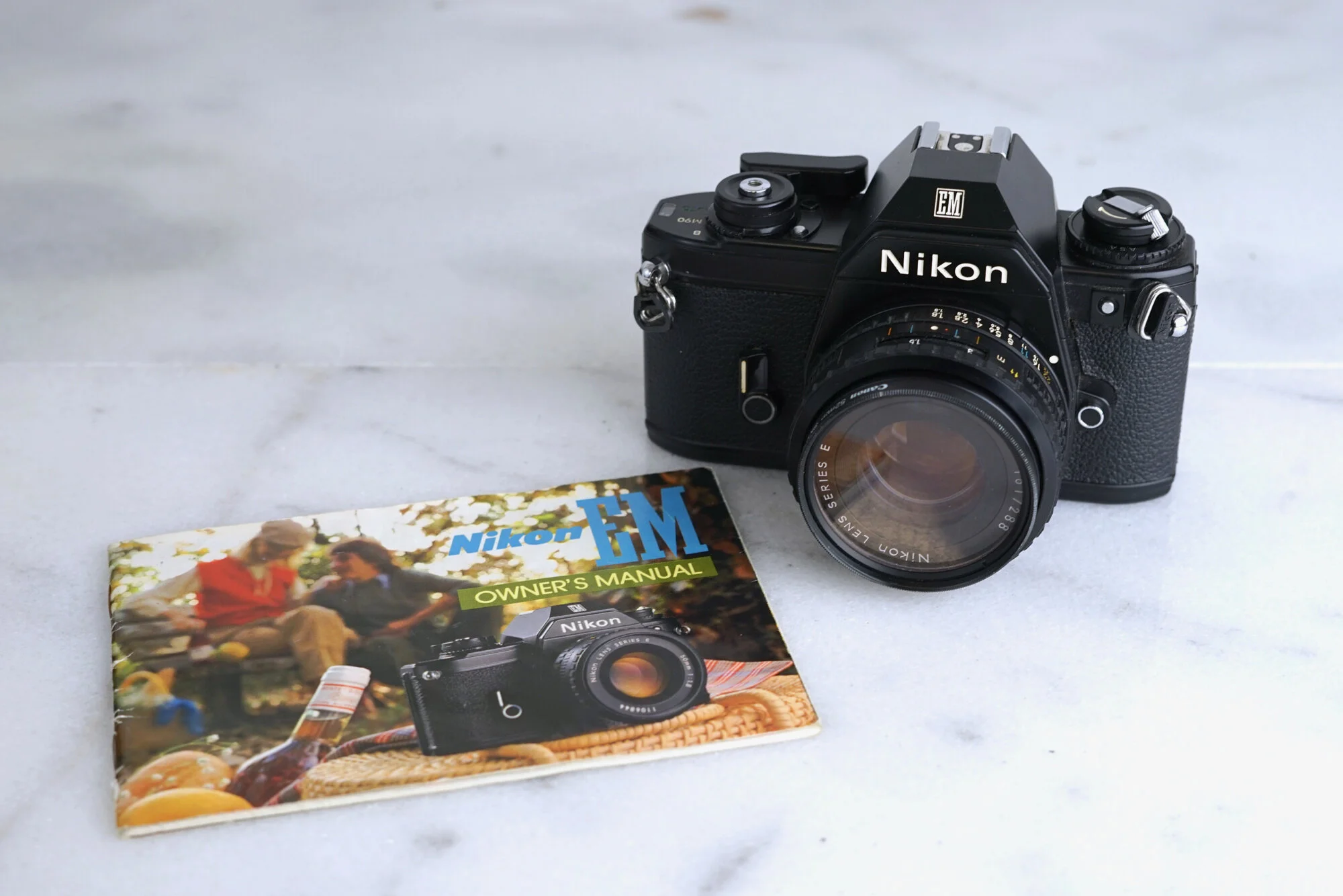 Nikon EM 35mm Film SLR Camera with Nikon 50mm F/ 1.8 Series E Lens