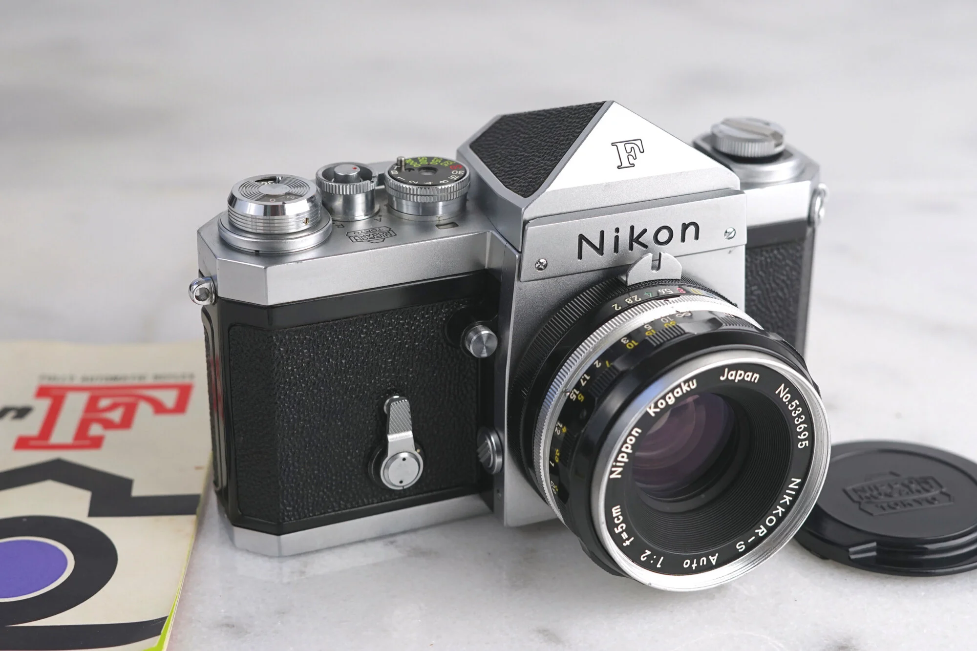 Nikon F 64xxxxx Serial Number 35mm Film SLR Camera with Prism Finder and Nikkor 50mm F/2 Fast Prime Lens, Manual, Lens Cap - Fully Functional