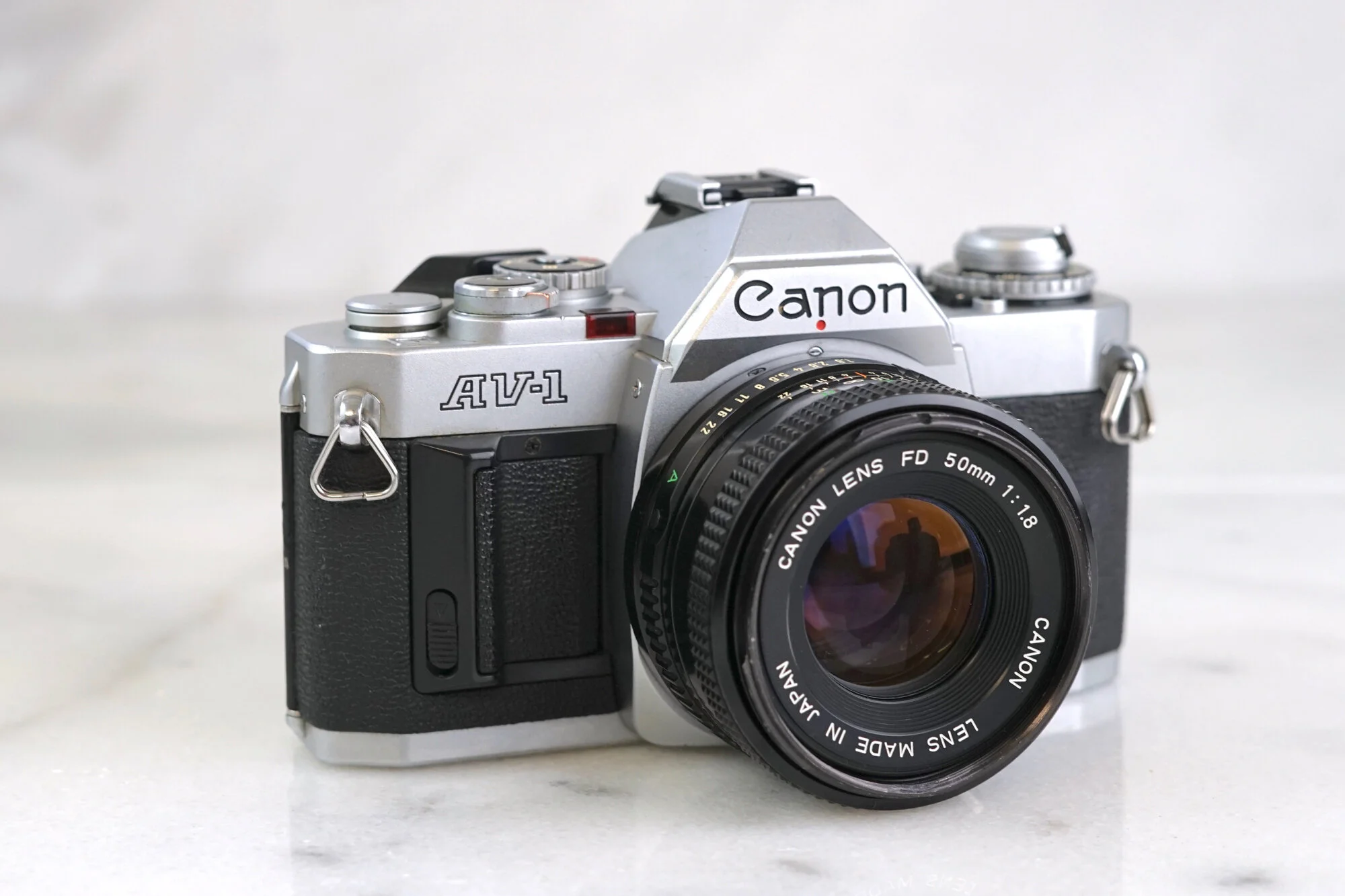 Canon AV-1 35mm Film SLR Camera with Seikanon Canon FD Mount 28-70mm Zoom Lens, and Battery - Fully Functional