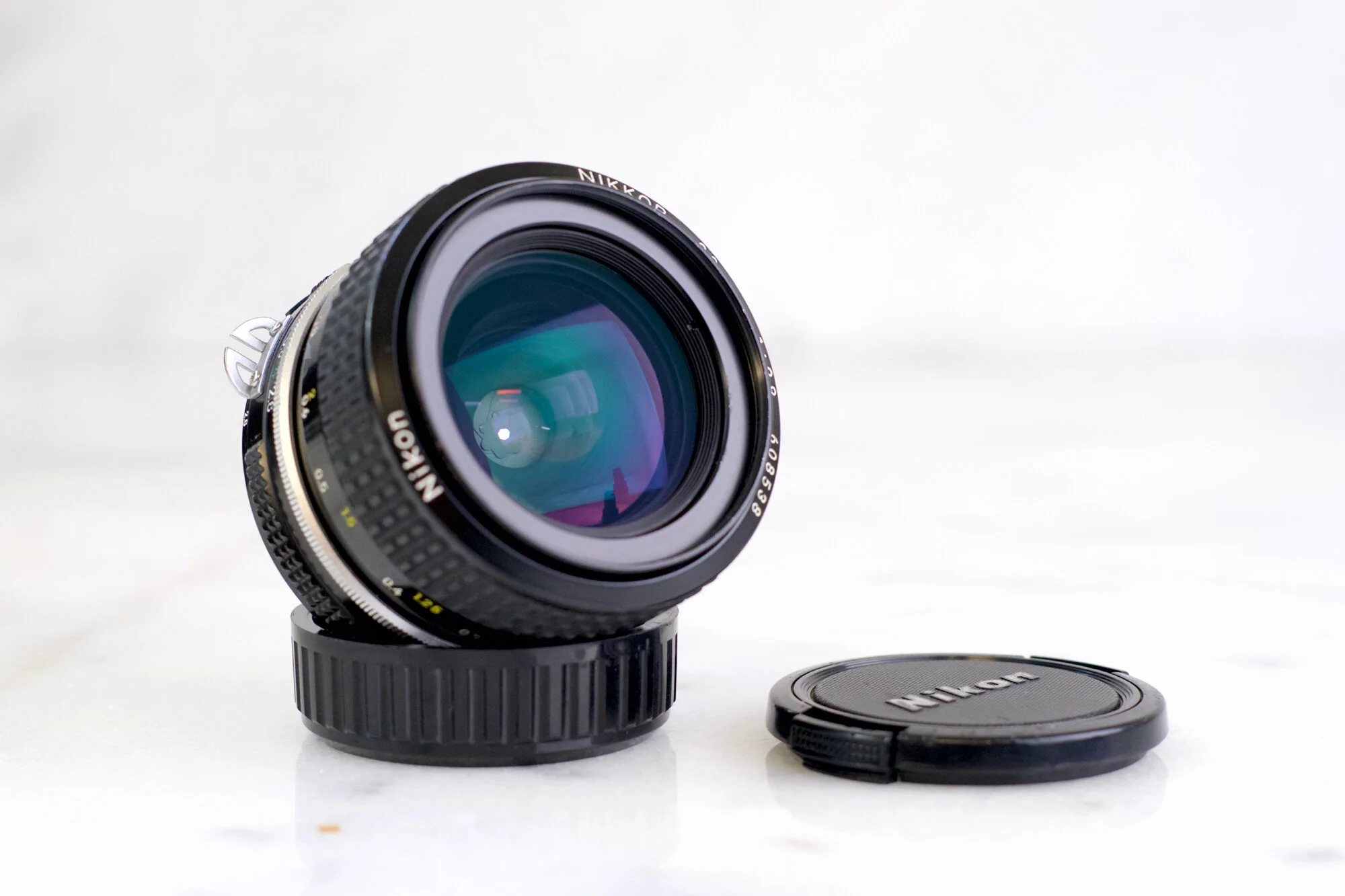 Nikon Nikkor 28mm F/2.8 AI Wide Angle Lens with Caps for Nikon 35mm Film SLRs and DSLRs / Mirrorless with Adapter