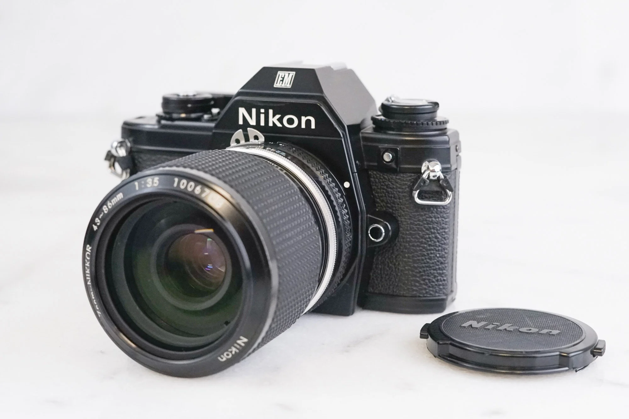 Nikon EM 35mm Film SLR Camera with Nikon Nikkor 43-86mm F/3.5 Zoom Lens - Fully Functional