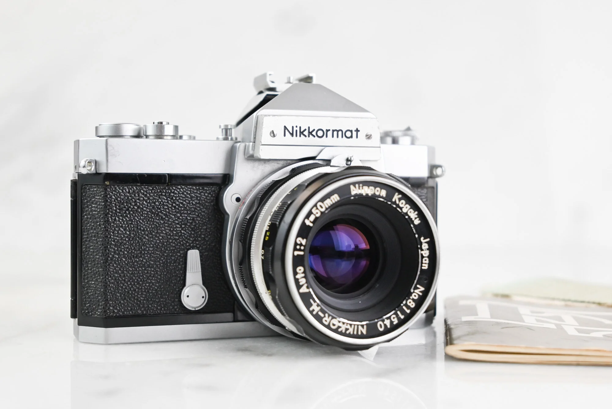 Nikon Nikomat FTn 35mm Film SLR Camera with Nikon Nikkor-H Auto 50mm F/2 Fast Prime Lens