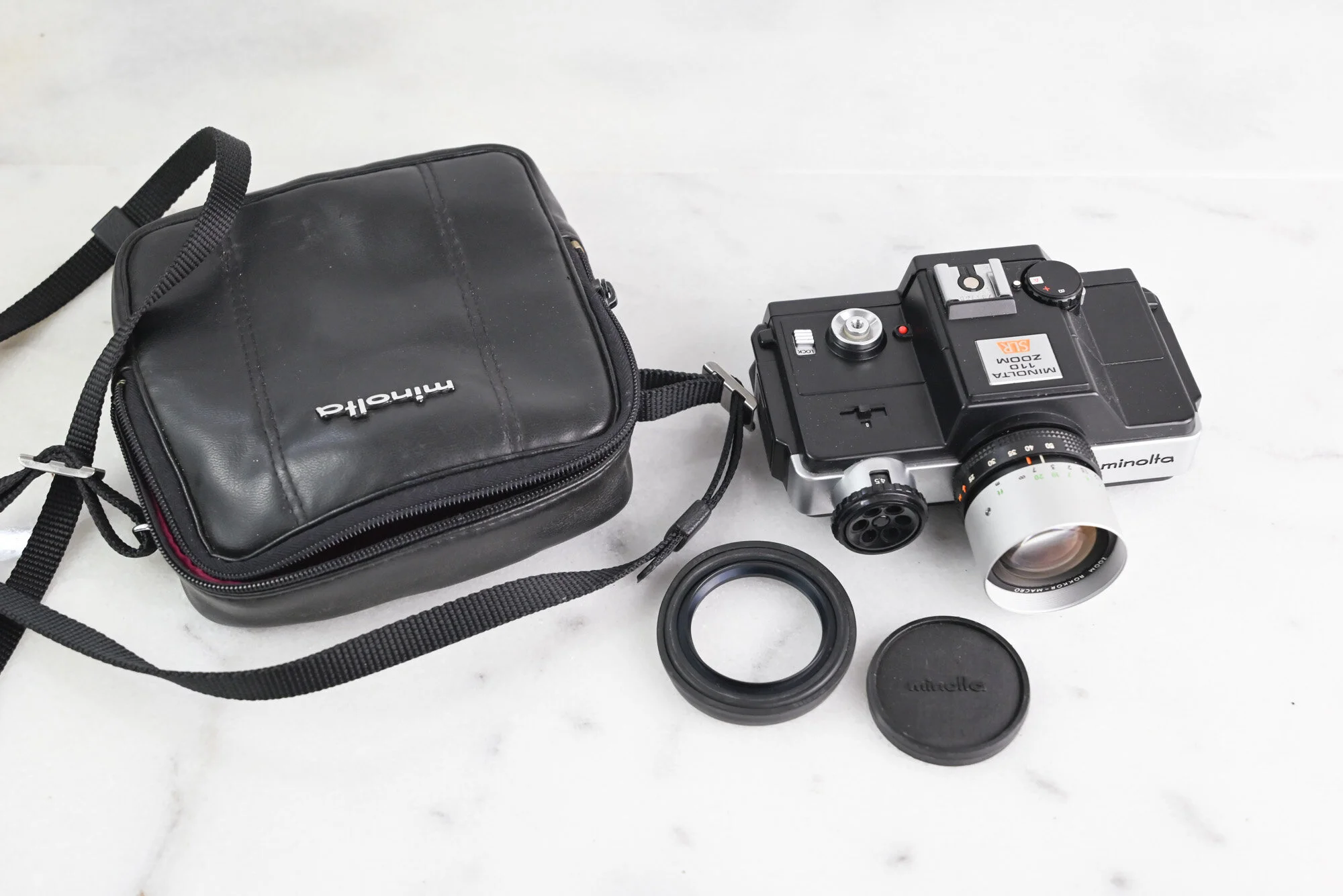 Minolta 110 Zoom SLR Film Camera with Minolta Hood, Cap, and Carrying Case - Fully Functional