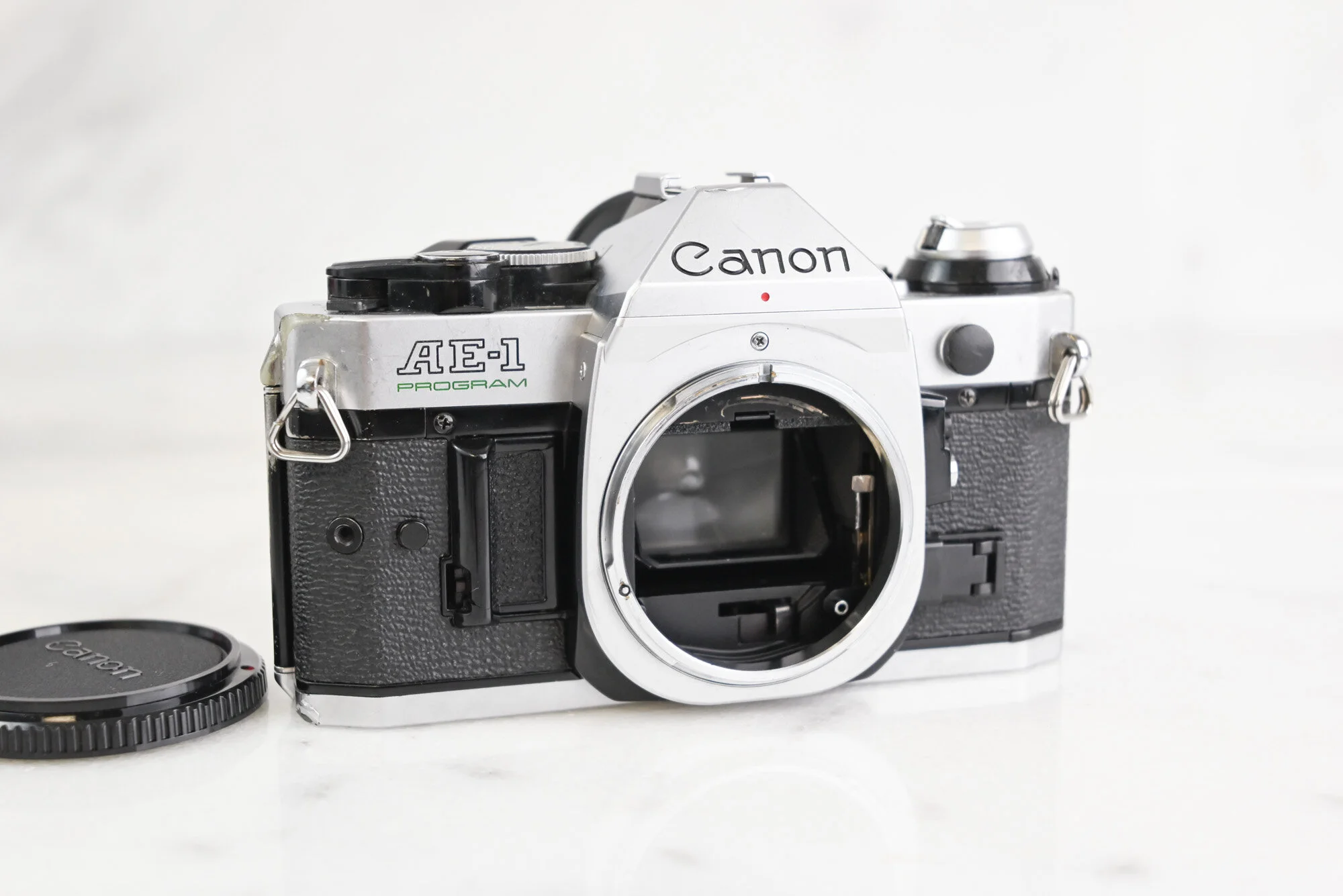 Canon AE-1 Program 35mm Film SLR Camera Body with Body Cap and Battery
