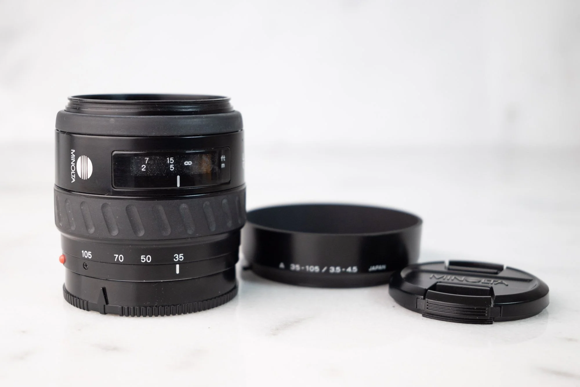 Minolta Zoom 35-105mm F/3.5-4.5 Zoom Lens - With Caps and Lens Hood