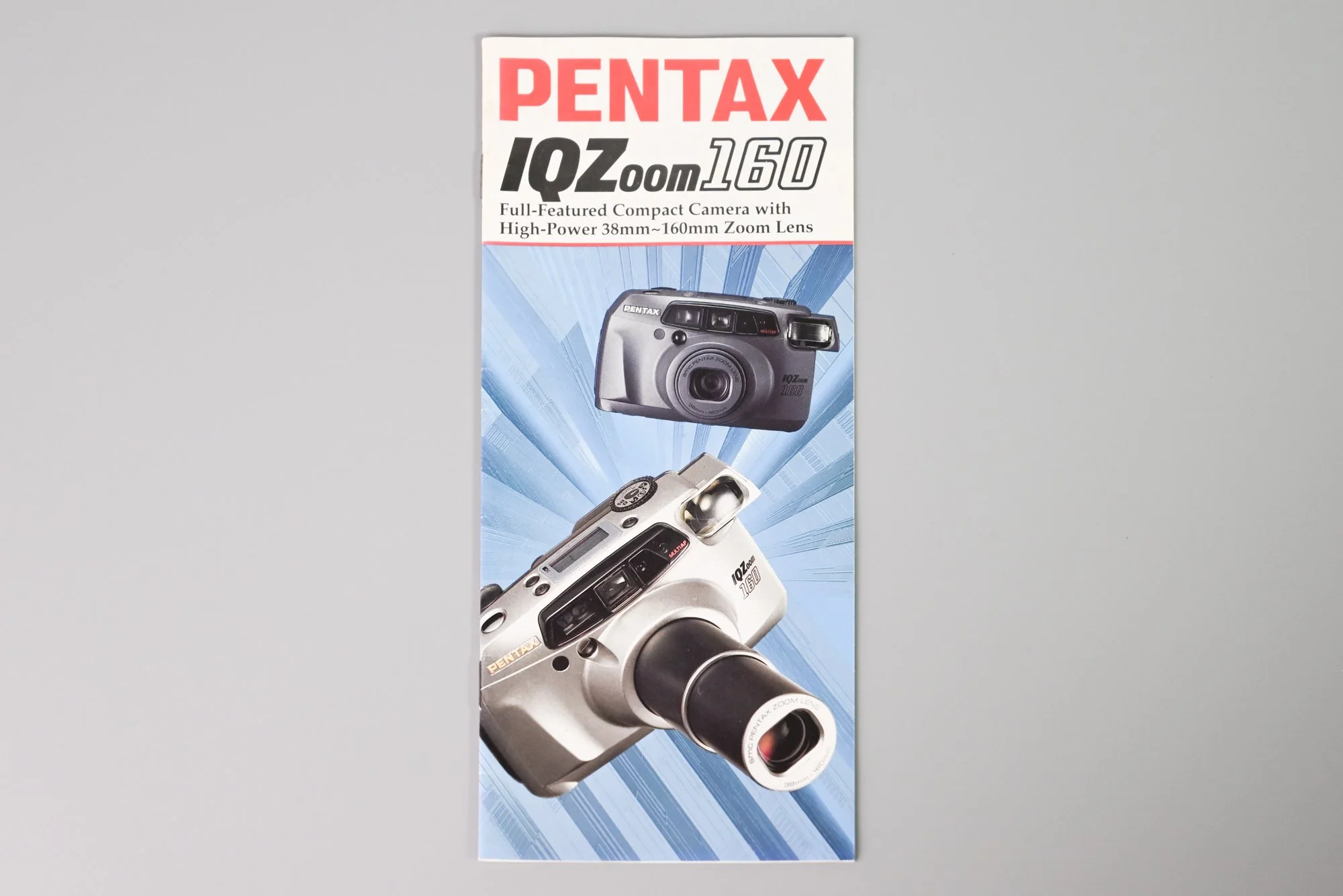 Pentax IQ Zoom 160 Sales Brochure (Blue)