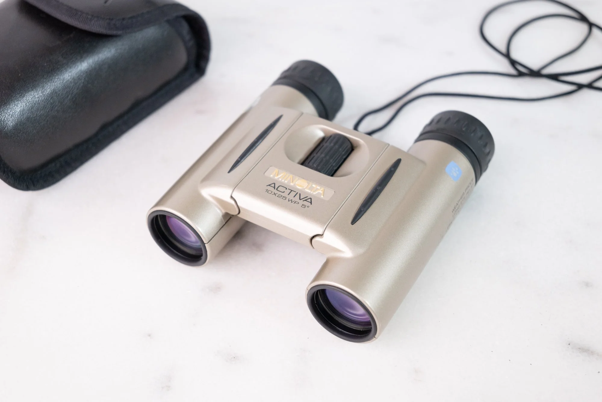 Minolta Activa 10 X 25 WP 5 Degree Weatherproof Optically Coated Compact Binoculars with Carrying Case