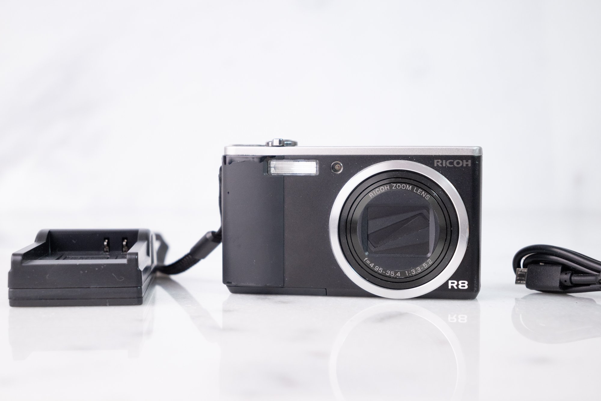 Ricoh R8  10 Megapixel Compact Premium Digital Camera with Charger, Battery, Strap