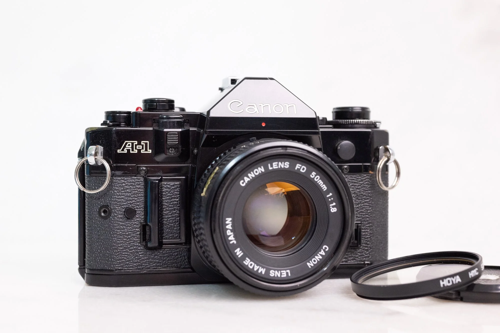 Canon A-1 35mm Film SLR Camera with Canon FD 50mm F Lens, Battery — F  Stop Cameras