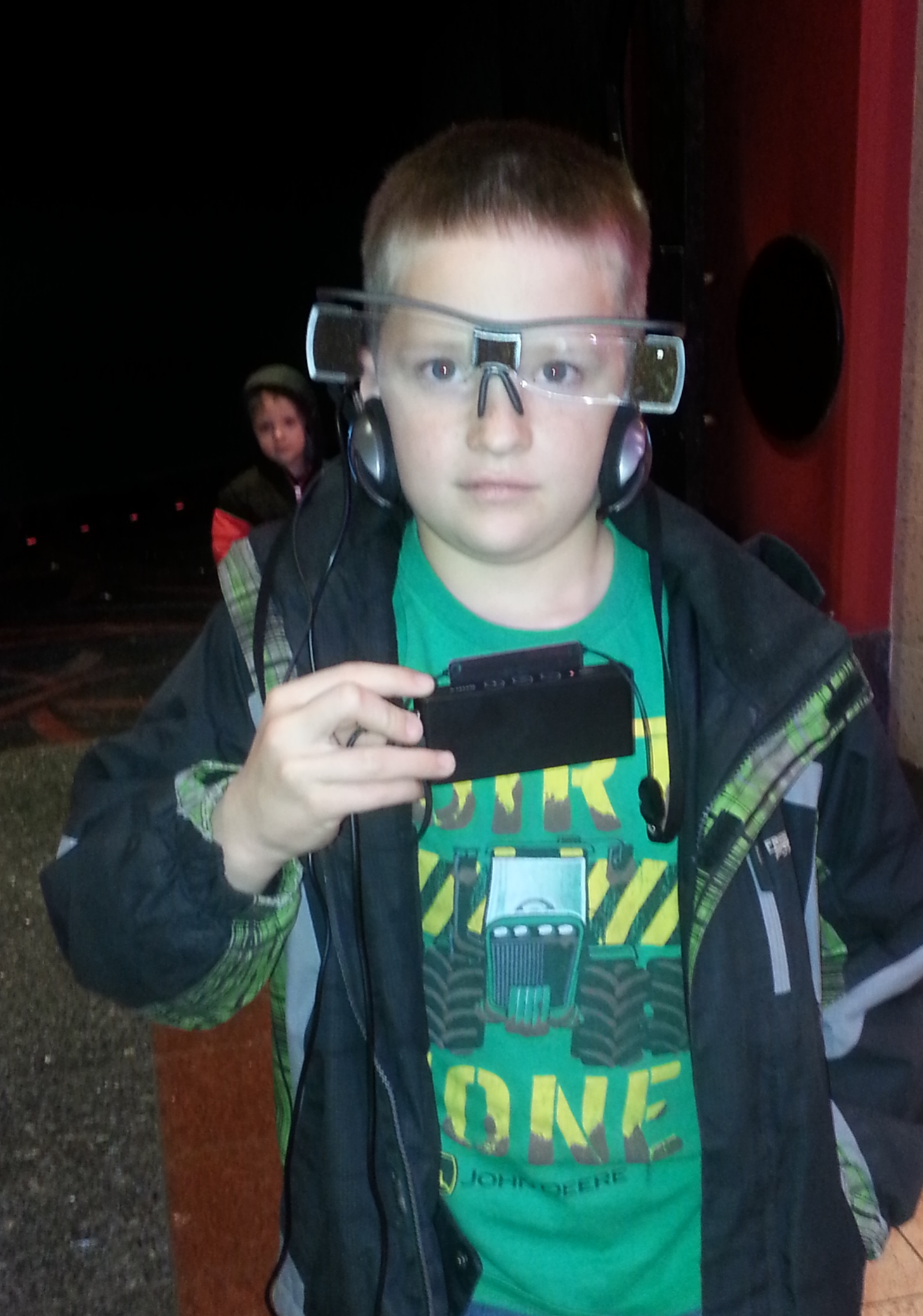 My Nephew modeling the captioning glasses and headphones at Edwards in Idaho Falls after watching Star Wars VII.