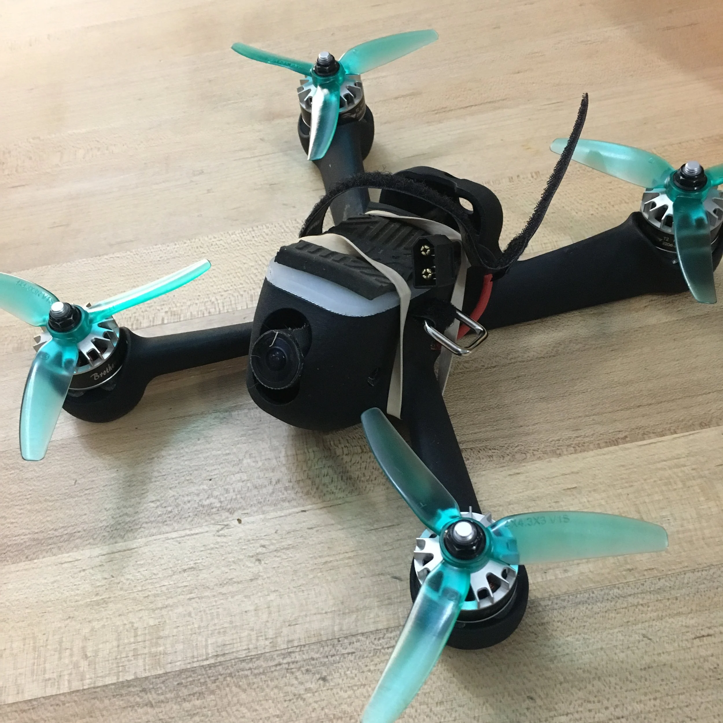 The rubber band helps hold down the battery since the strap slot is a weak point.