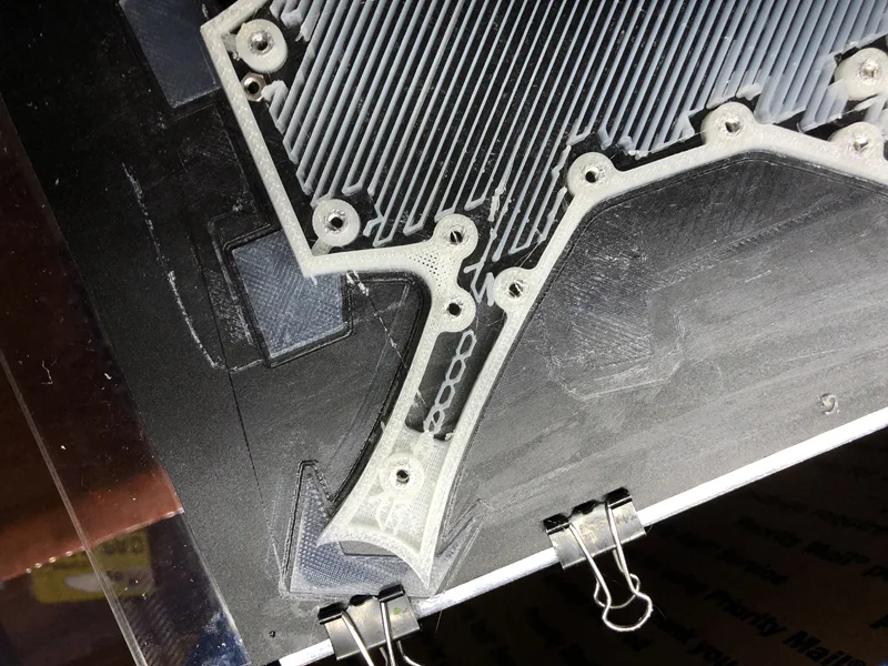 The nuts are in and safely ensconced. The nozzle knocked one out and I had to reinsert it as the print was running (that's why there's an extra nut sitting up top). If I hadn't caught it the whole part would've been ruined. Off to bed at 5am.