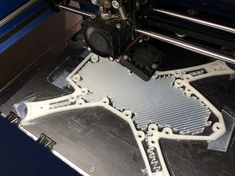 There's the tabs doing their job. The one on the left was starting to lift so I added a clip. Look at all that support (I screwed up, the arms don't need any).
