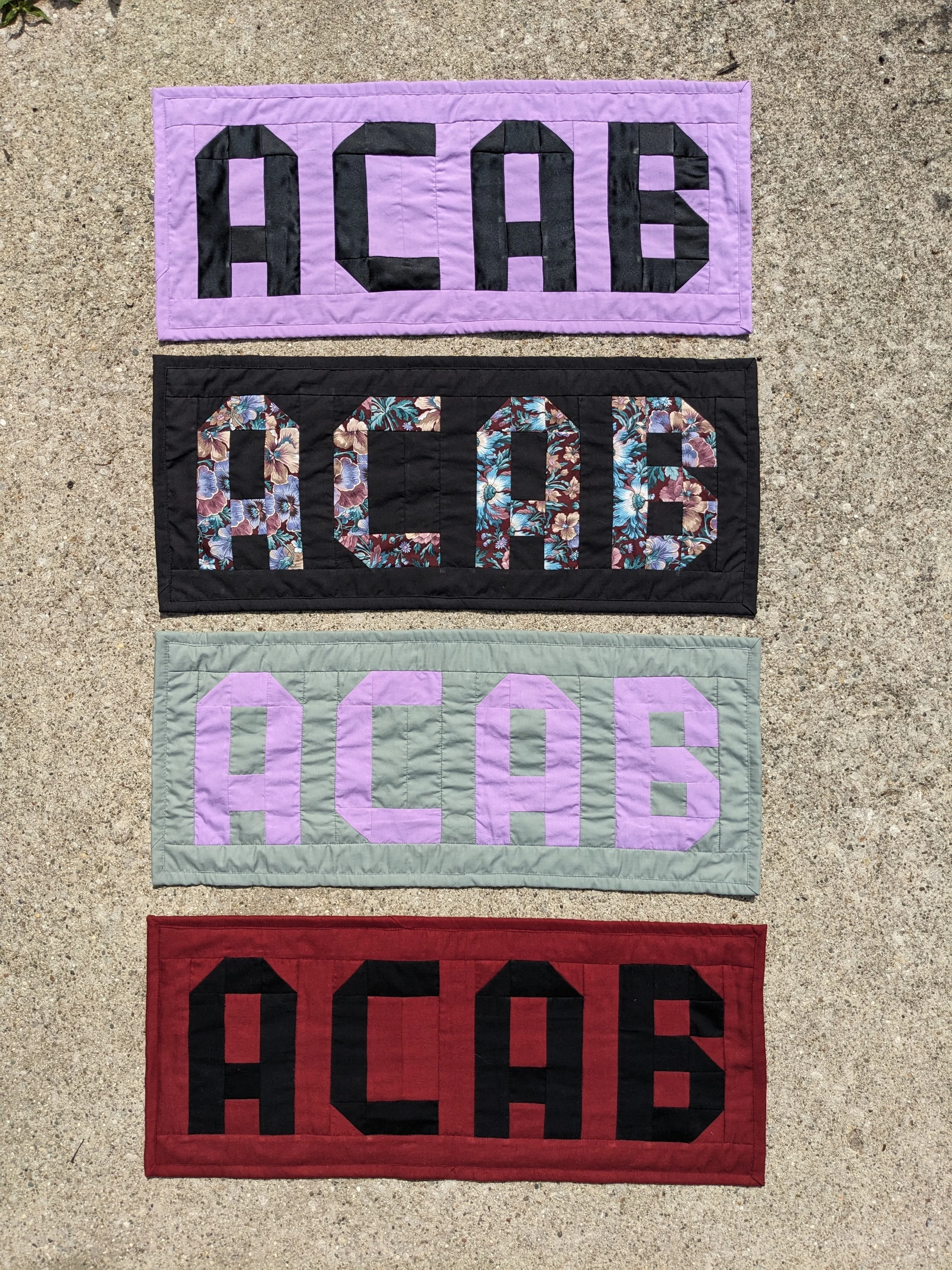11” x 26” each made with thrifted fabric and surplus band t-shirts inquire to purchase!
