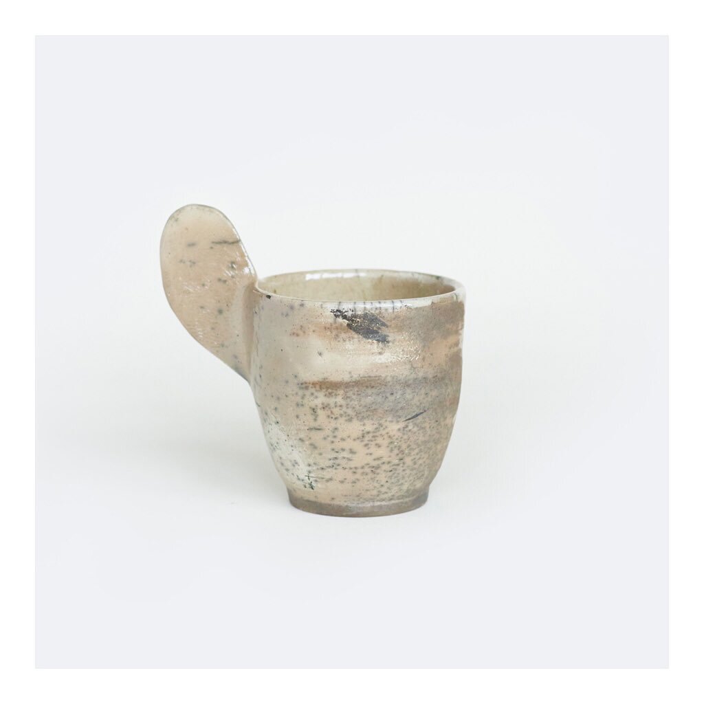T H U M B S cup. What if we all had big thumbs 🤔? This study in handles is exemplary of the &lsquo;Naked Raku&rsquo; technique which is known for these beautiful apocalyptic, smoke-y, mono-chromatic patterns. 

Raku is usually still porous after fir