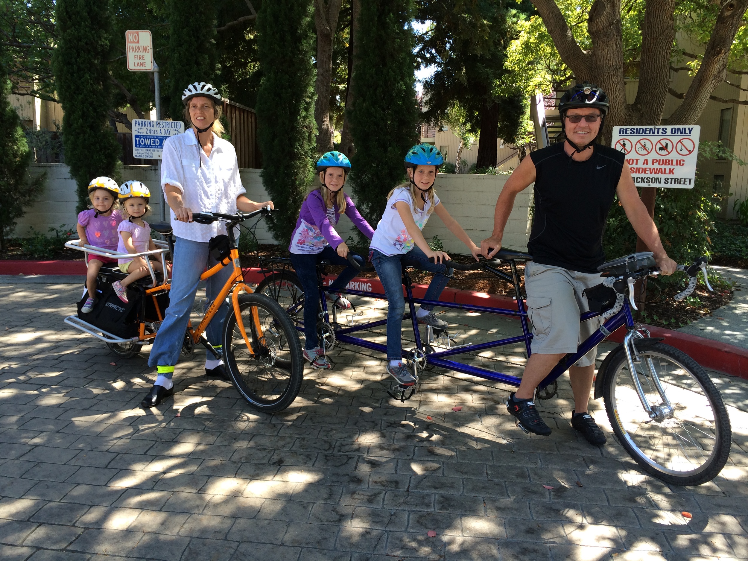 Helena, Jeff, their two sets of twins, and their two family bikes