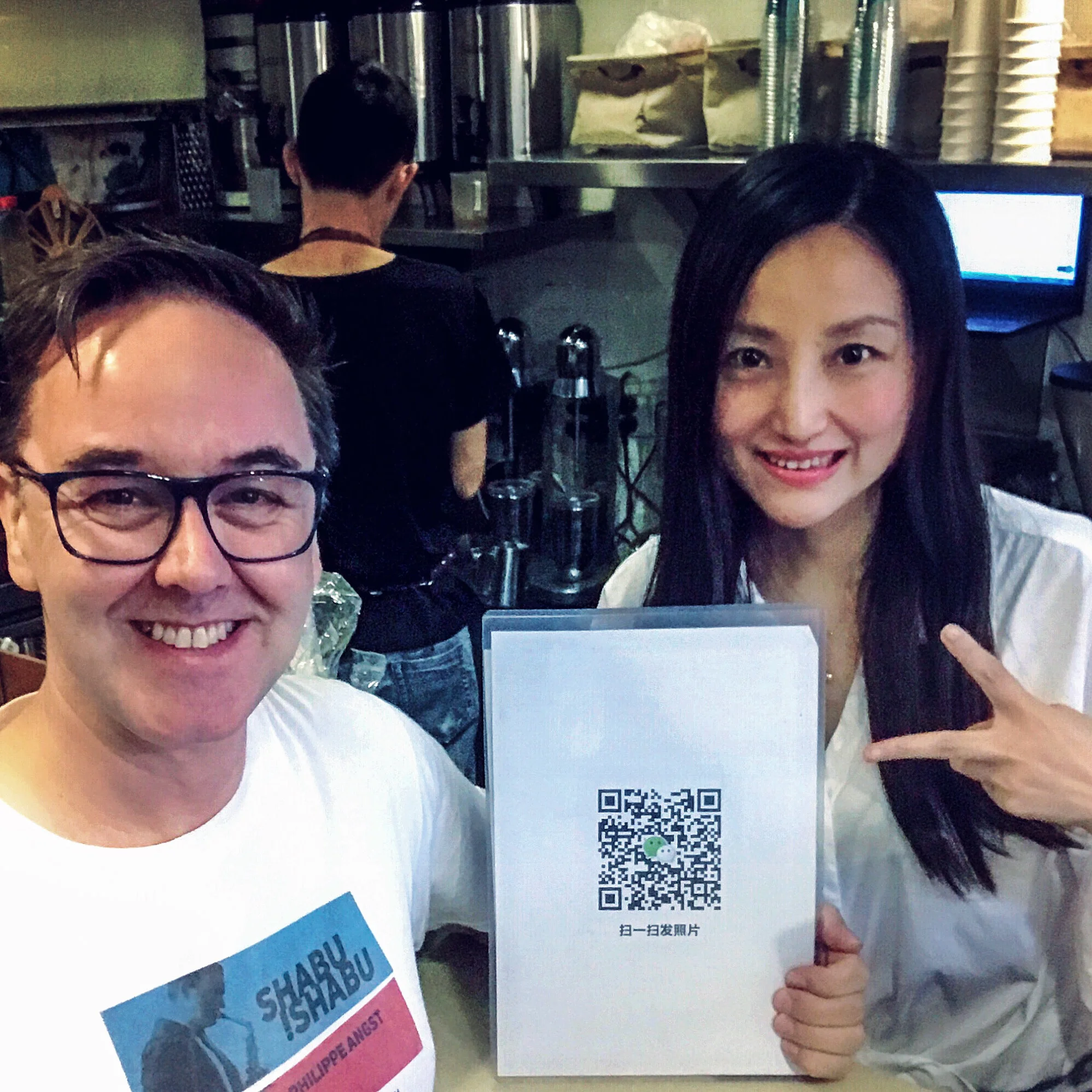 1.Coffee Owner and QR code.jpg